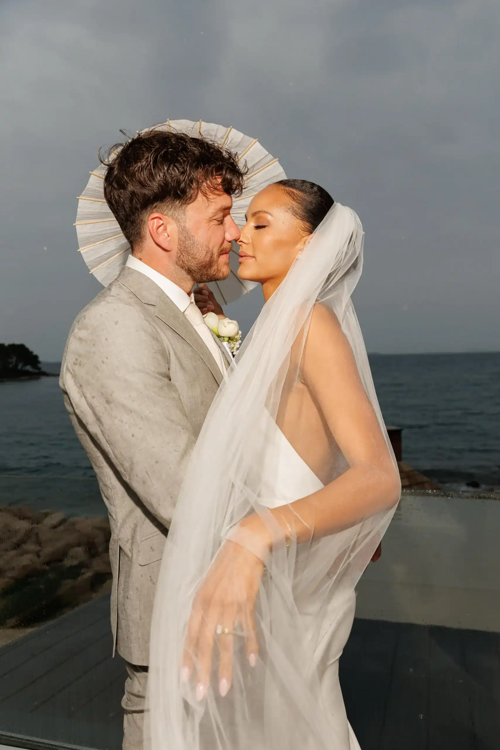 Couple in Croatia in a romantic moment out in stormy weather